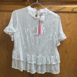 Sparkle with this White Andree top with silver dazzles short   sleeve sz M